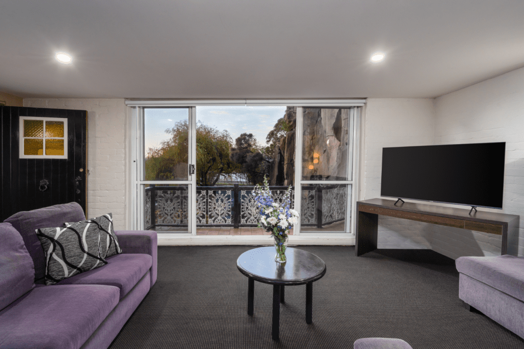 4-Bedroom Apartment living room with window & TV
