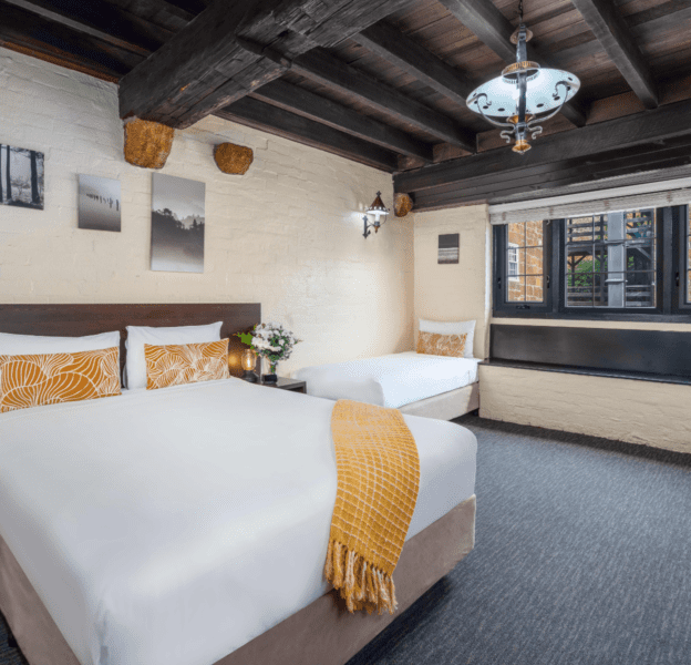 Triple Bed Guest Room with Queen Bed, Twin Bed and window