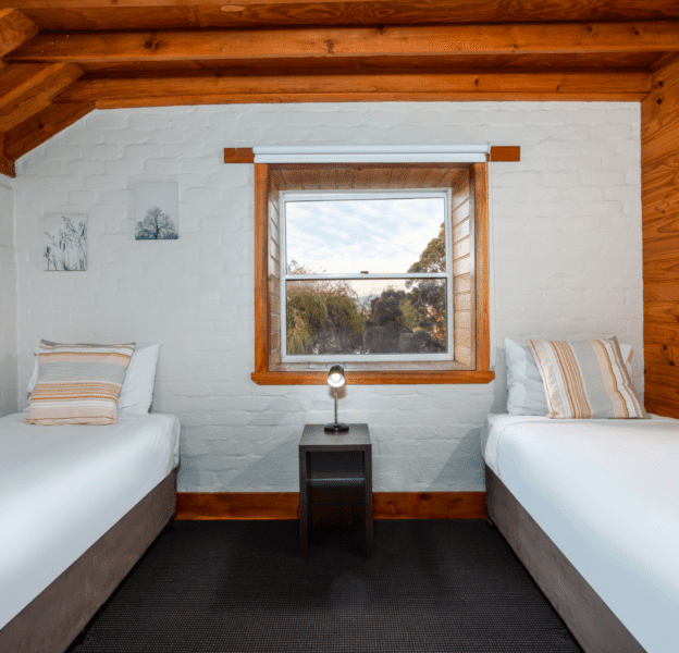 Twin Bed Room with nightstand and window